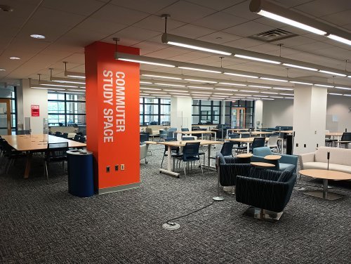 Large study space with many desks and chairs