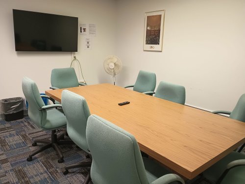A conference table with monitor