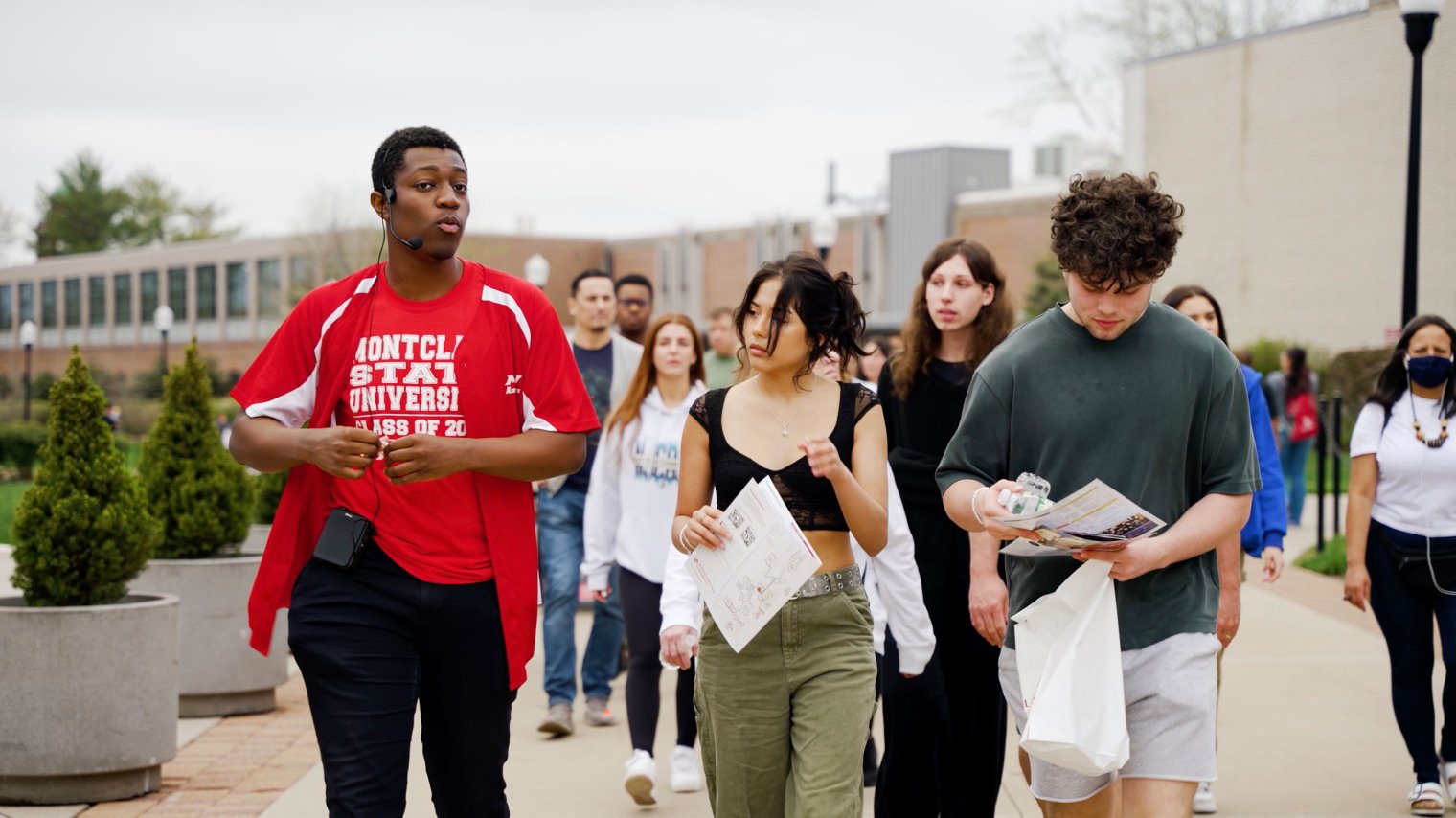 Richard Steiner-Otoo leads prospective students around campus.