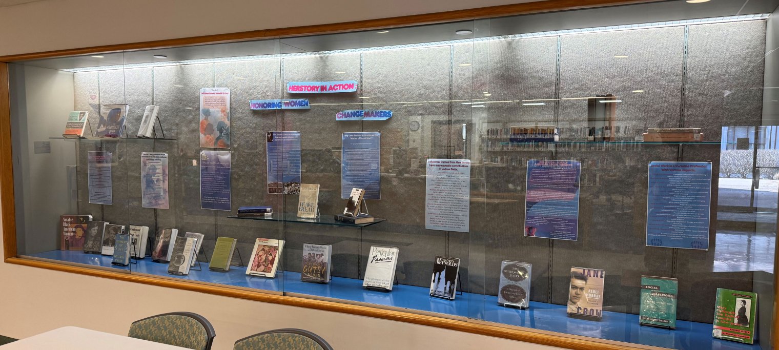 Exhibit case with books about and written by historical women