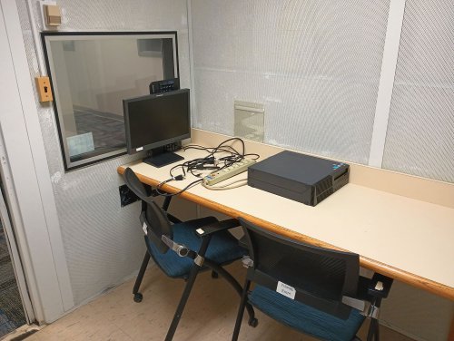 Listening room with a table, chairs, and computer