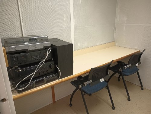 Listening room with a table, chairs, radio, and record player