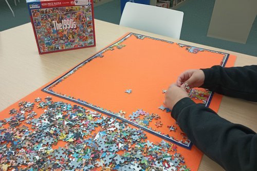student working on jigsaw puzzle