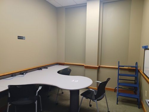 study room with table, chairs and whiteboard