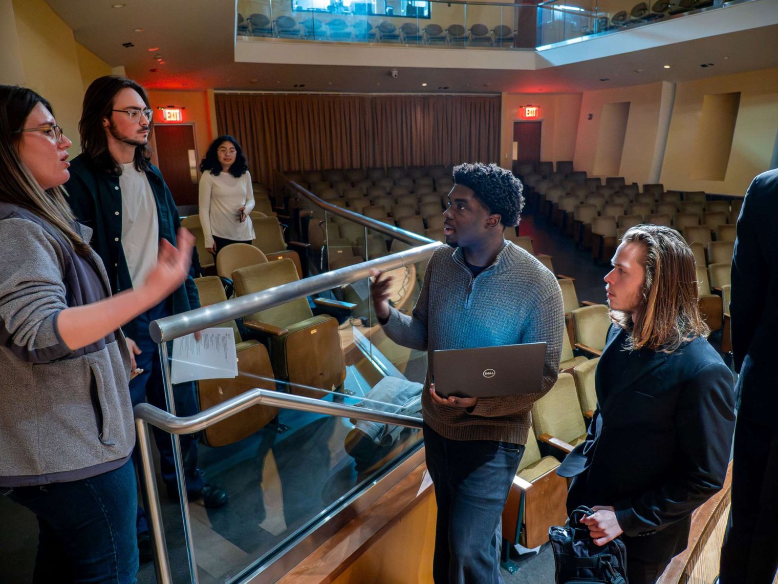 Students conferring before Hues Performance