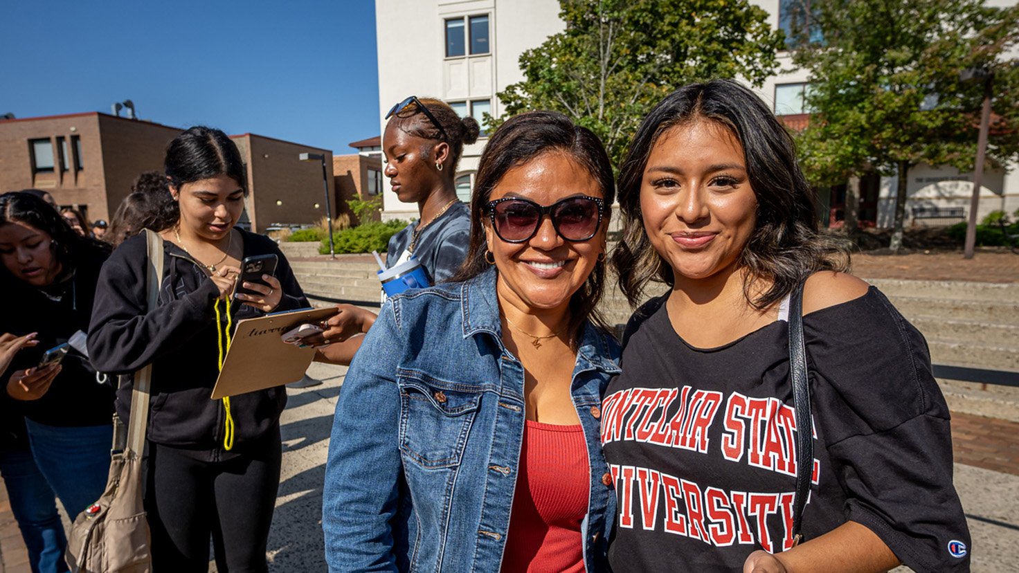 Student and mom smiling for a photo