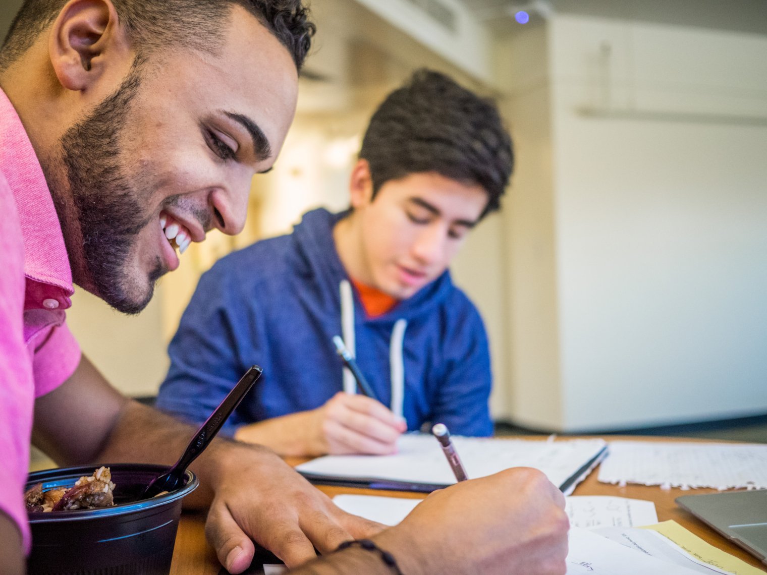 two students studying at a table