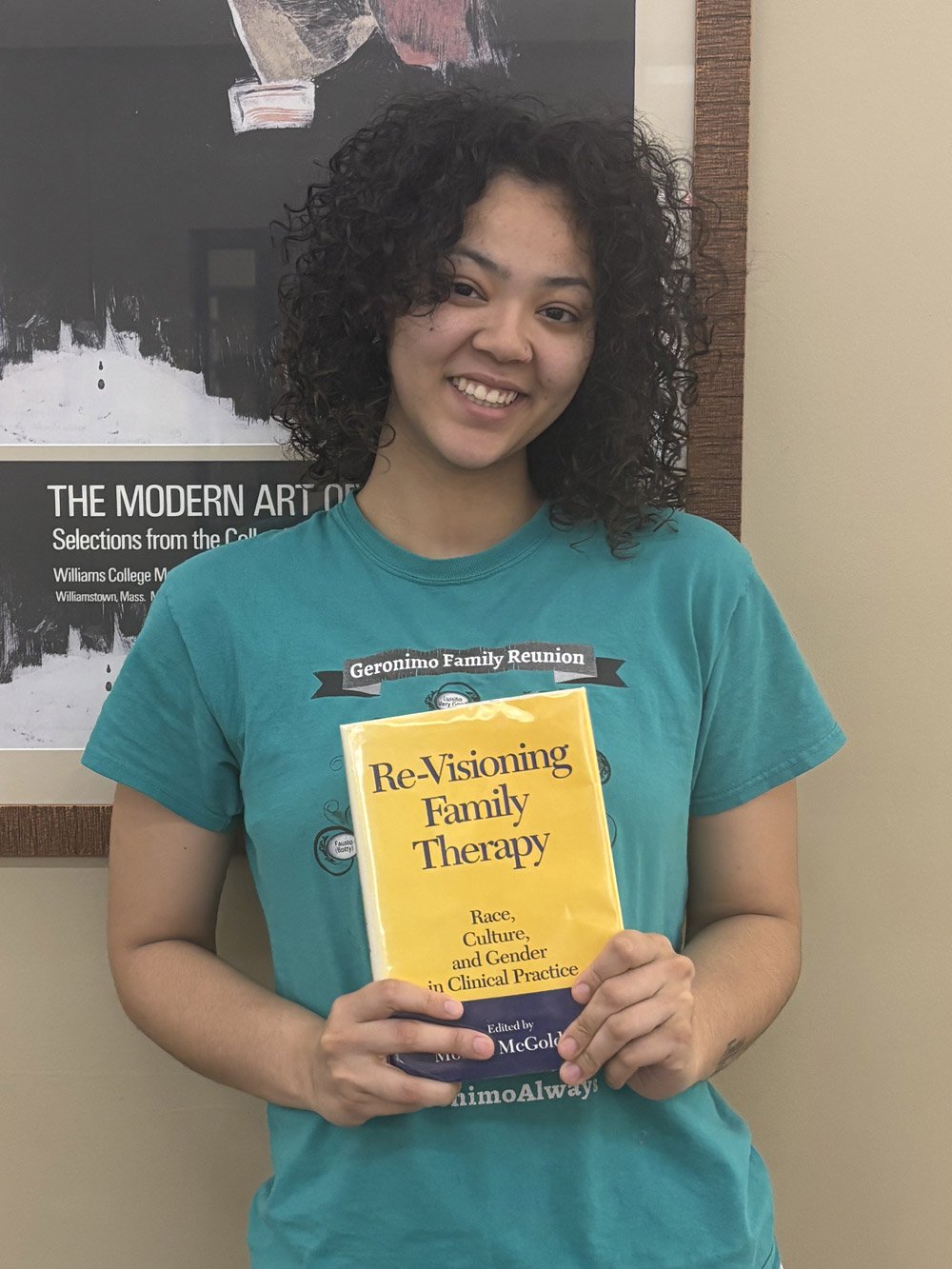 Angela Diaz holding a book