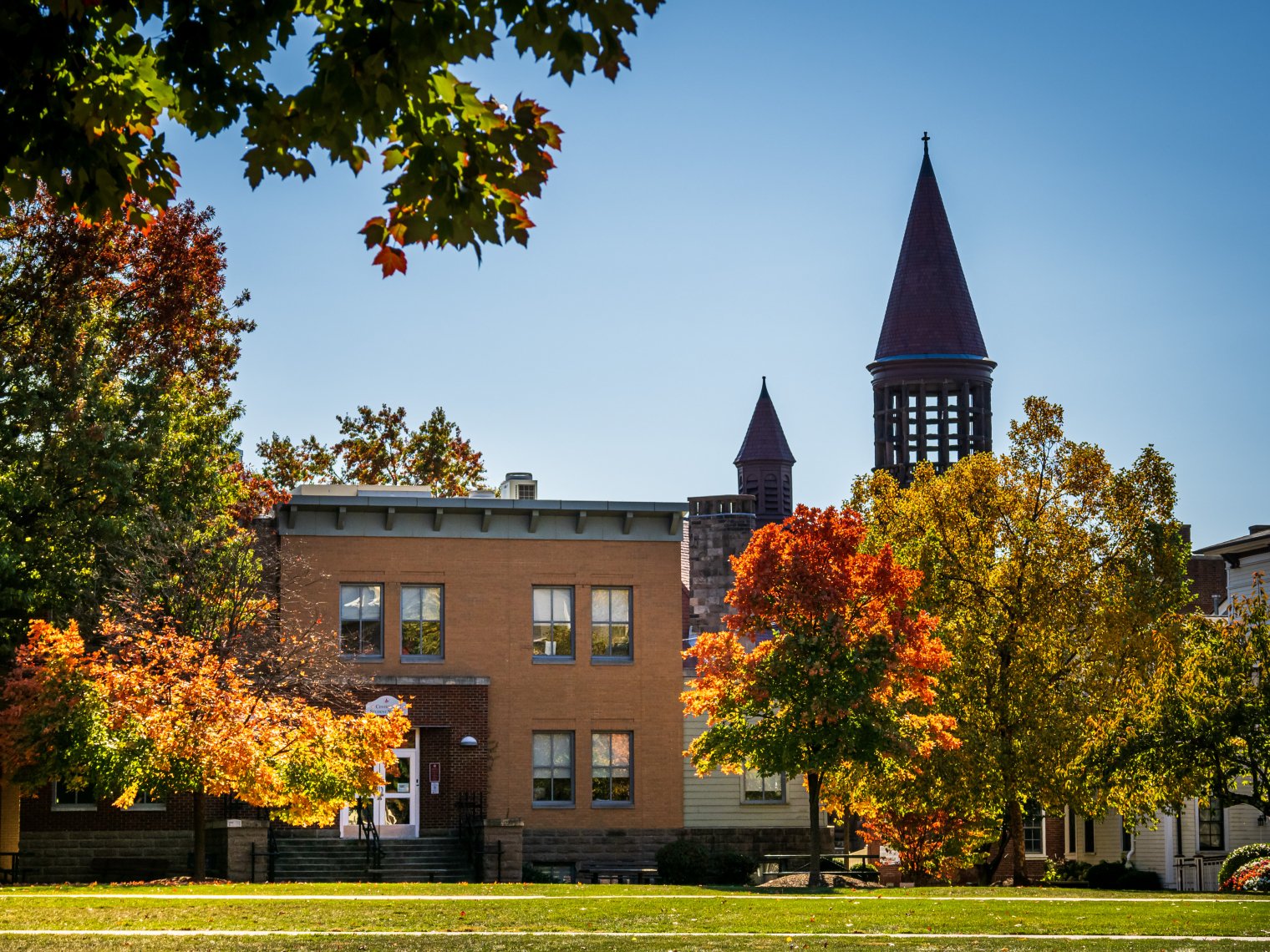 Photo of two buildings surrounded by trees
