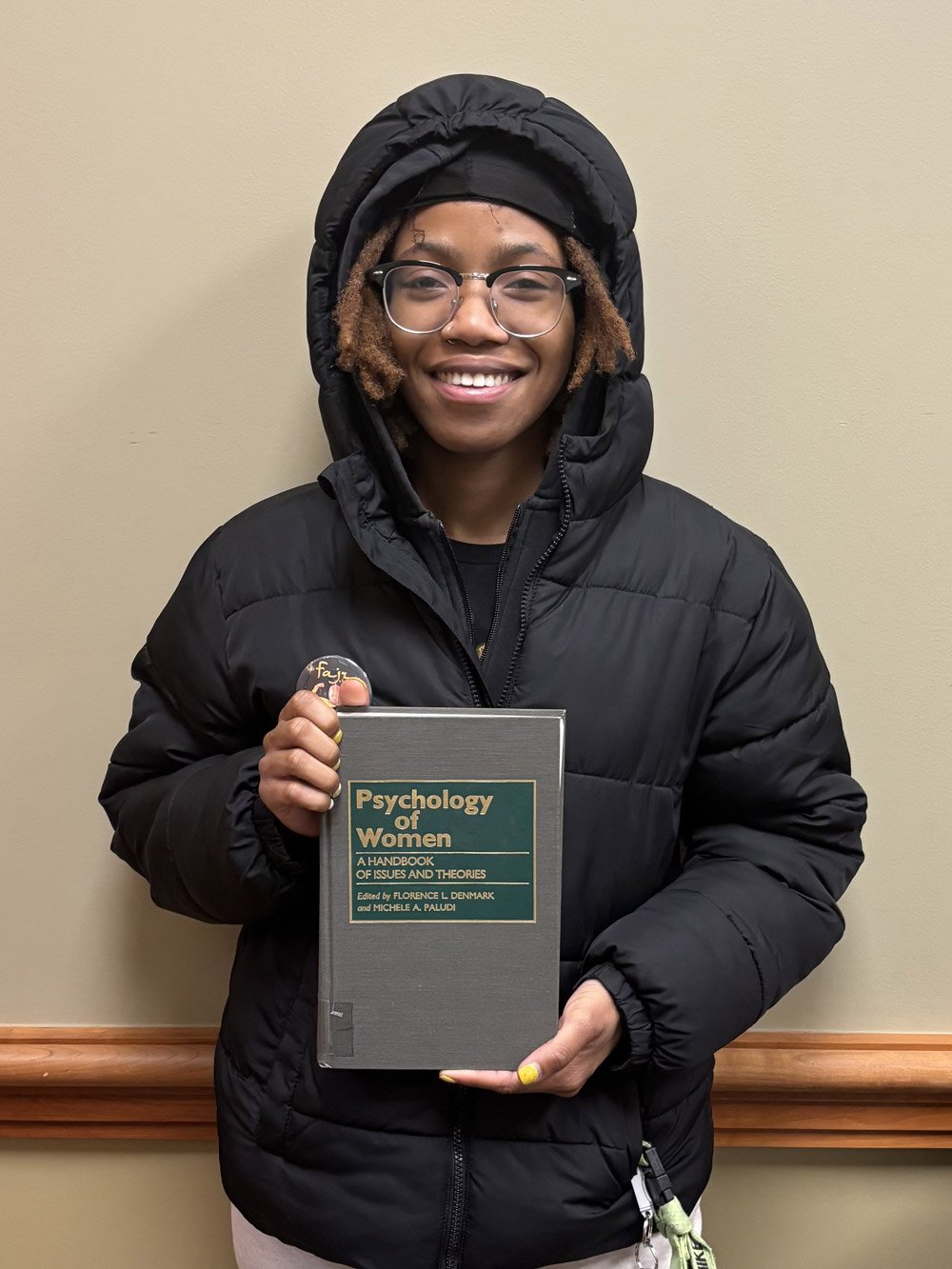 Dionna Green holding a book