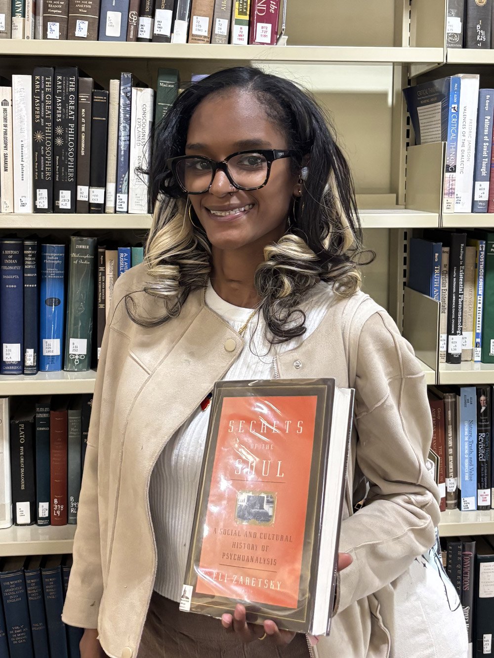 Kayla Leon holding a book