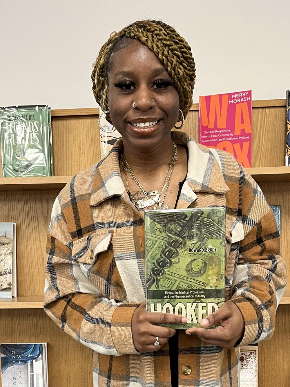 Nneoma Awobue holding a book