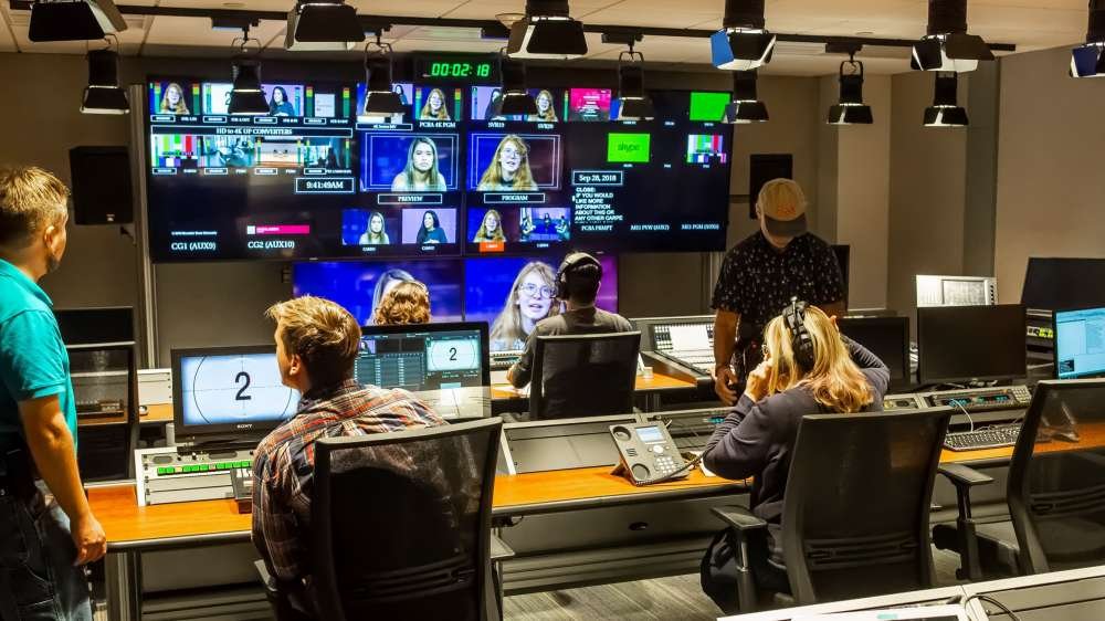 Students working in television production room