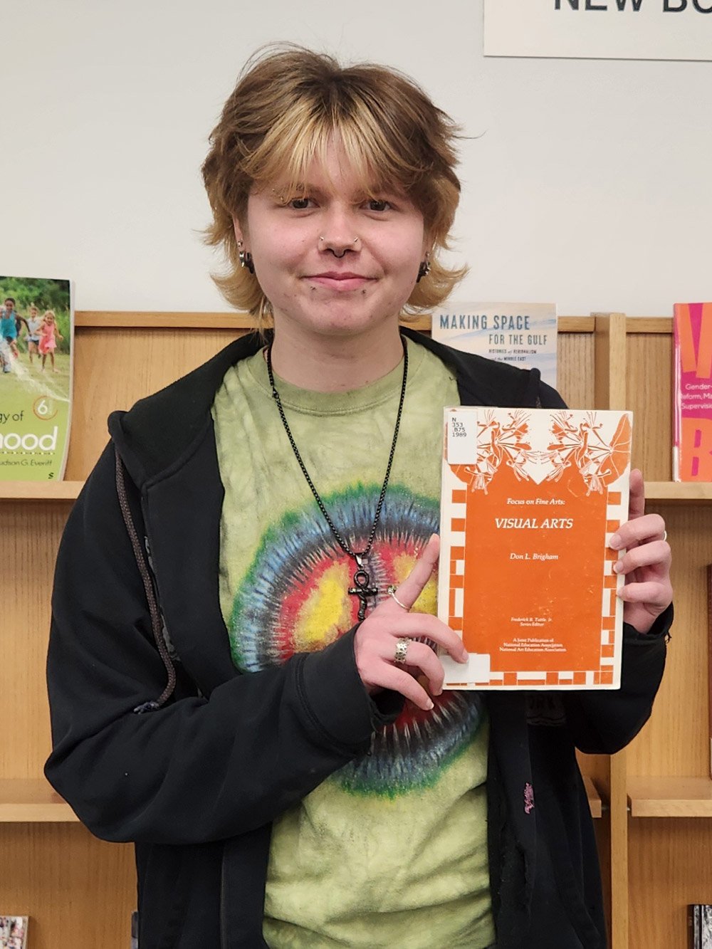Gabriel Marano holding a book