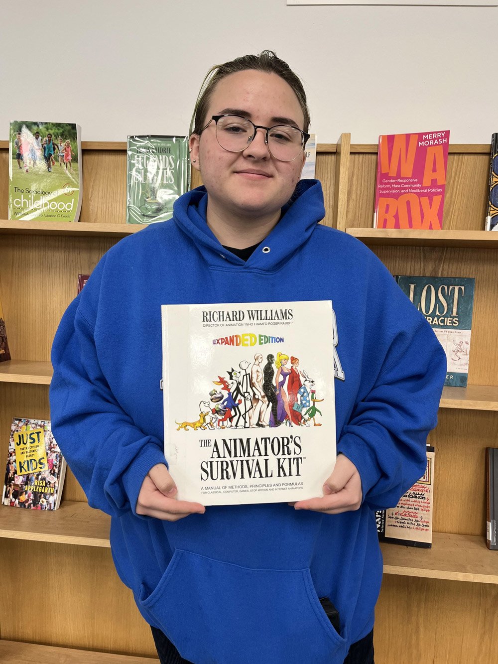 Kaiden Mendelsohn holding a book