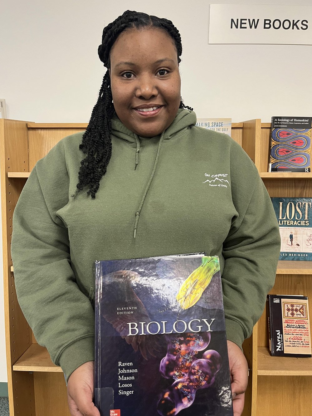 Renae Manahan holding a book