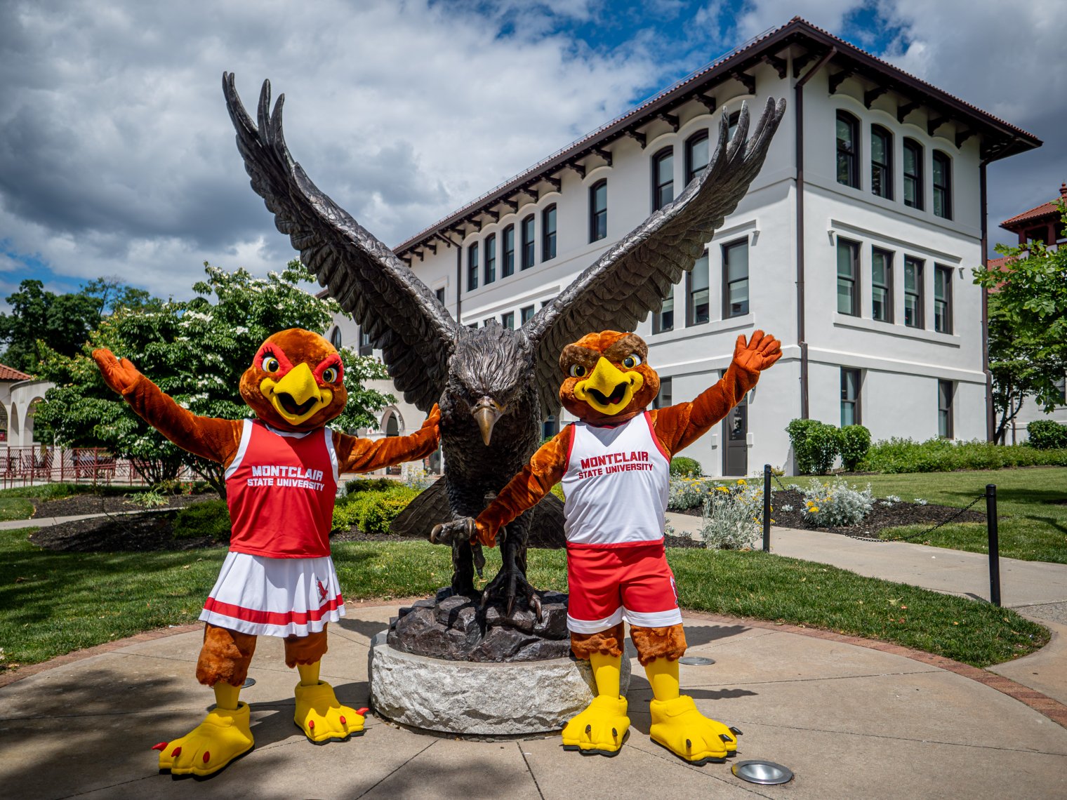Rocky and Roxy in front of the red hawk statue.