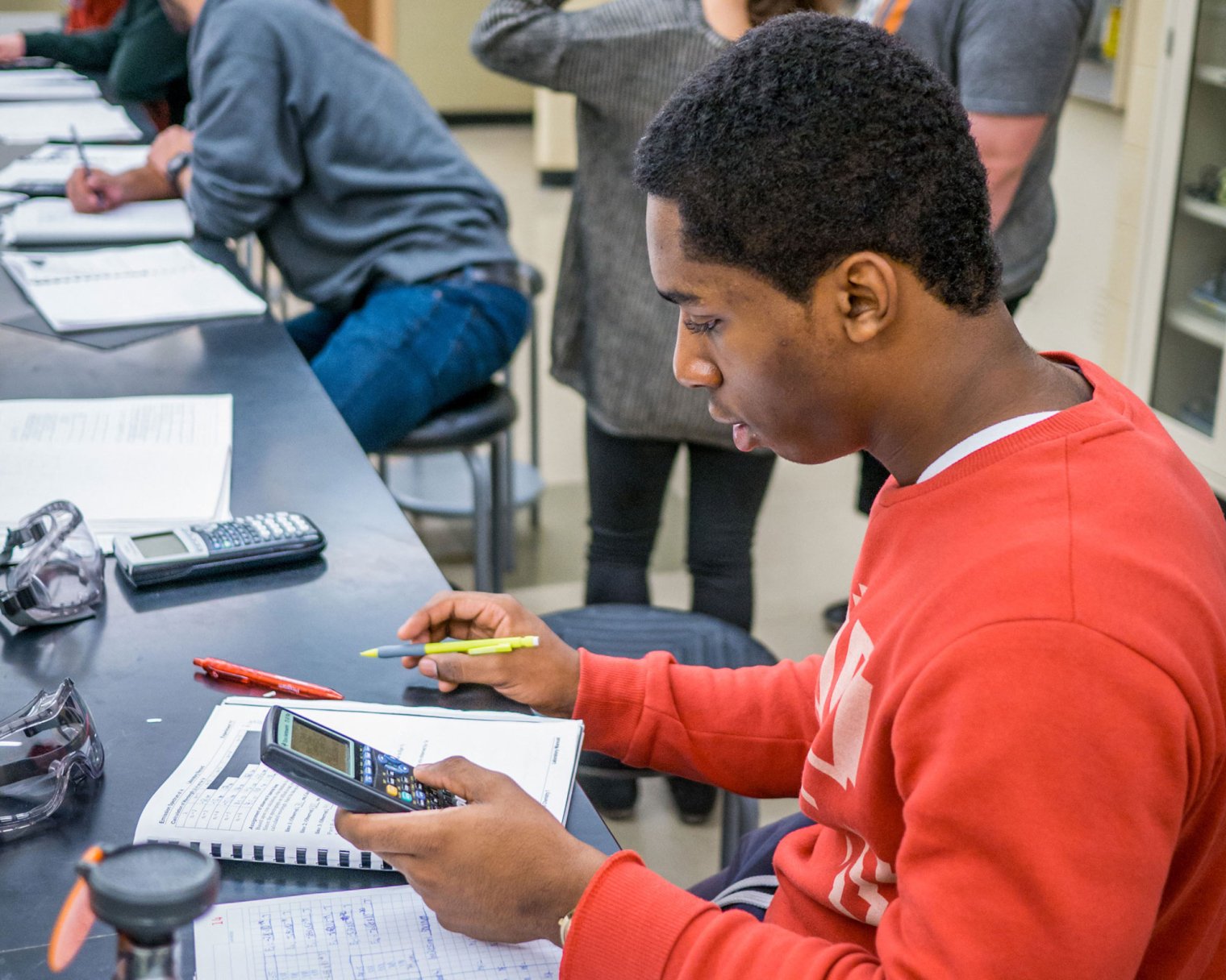 student solving a math equation