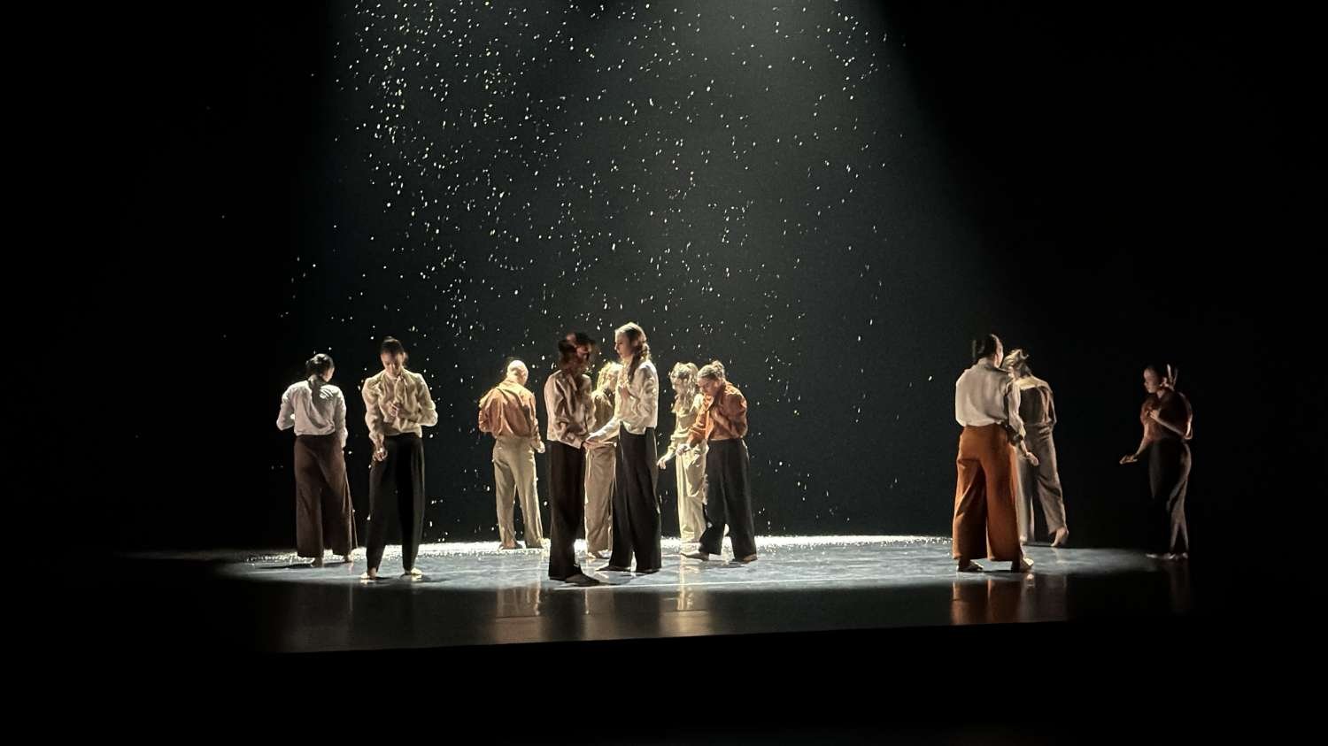 Dancers on stage with snow falling for Spring Dance 2026