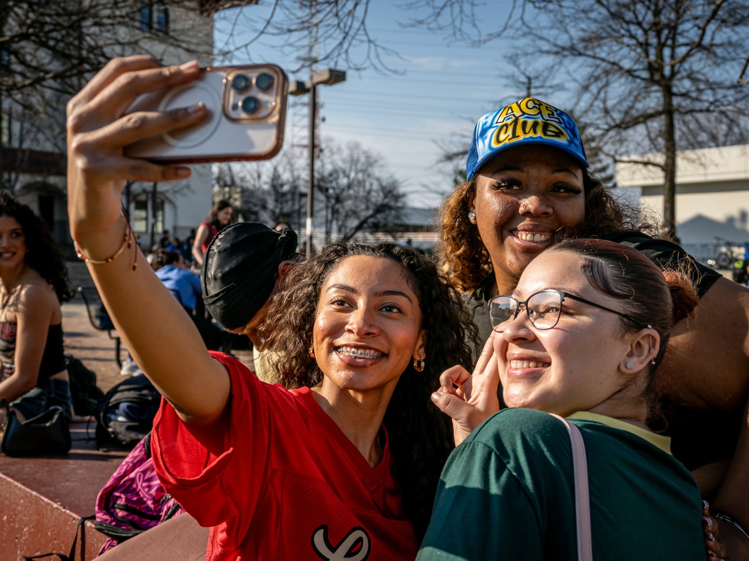 students taking a selfie on the quad