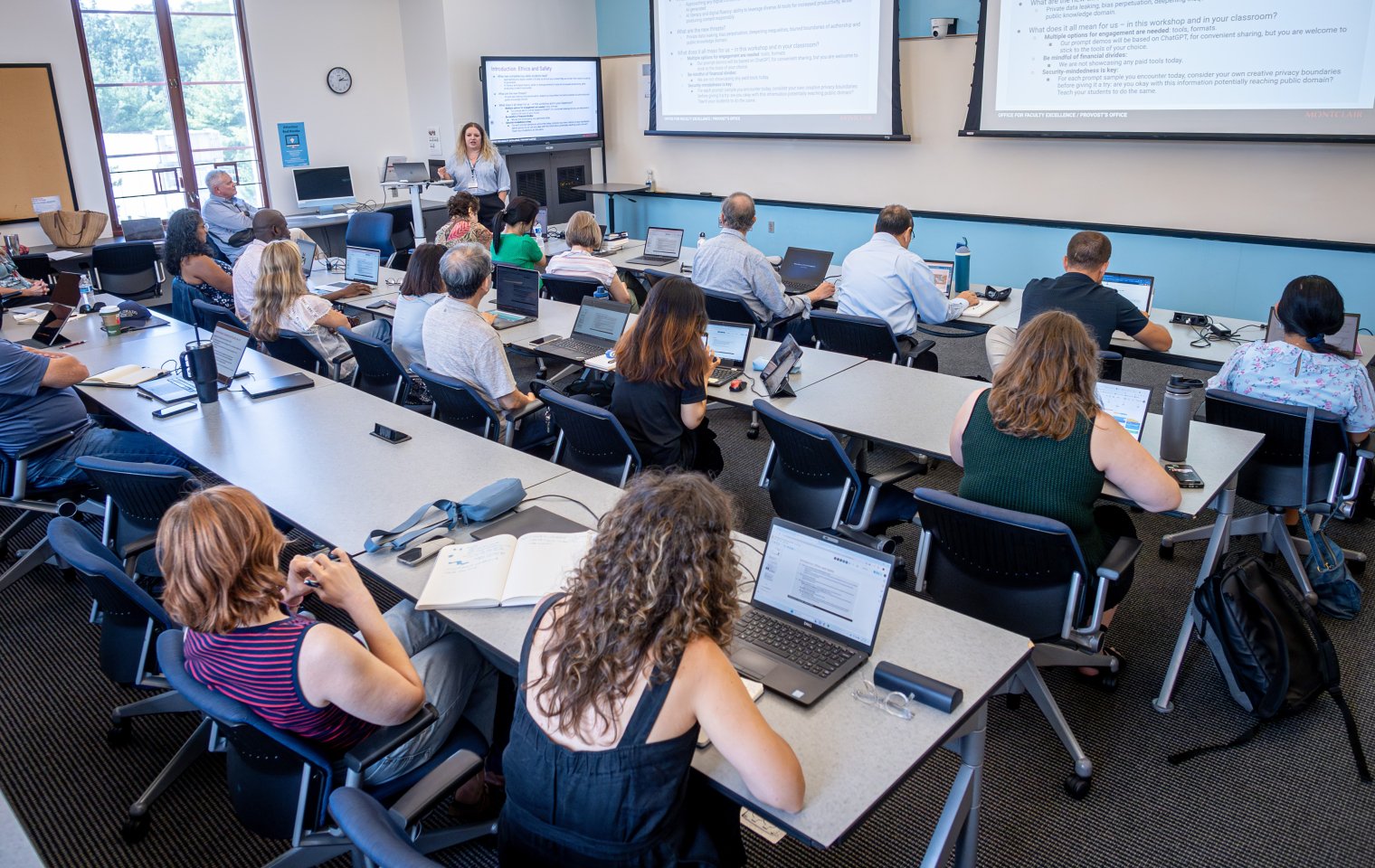 Faculty work on laptops in an ADP Center classroom in University Hall.