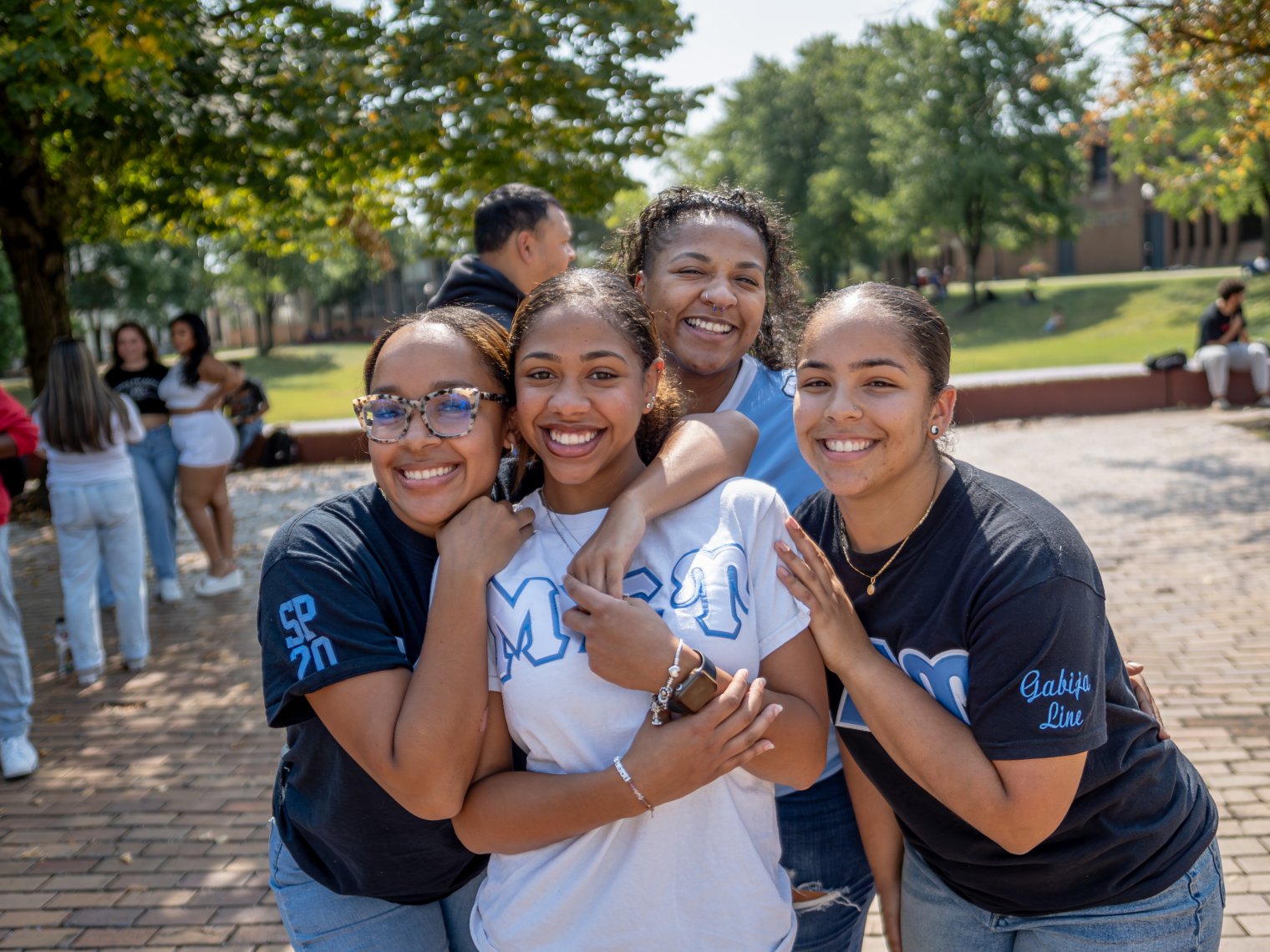 group of greek students hugging
