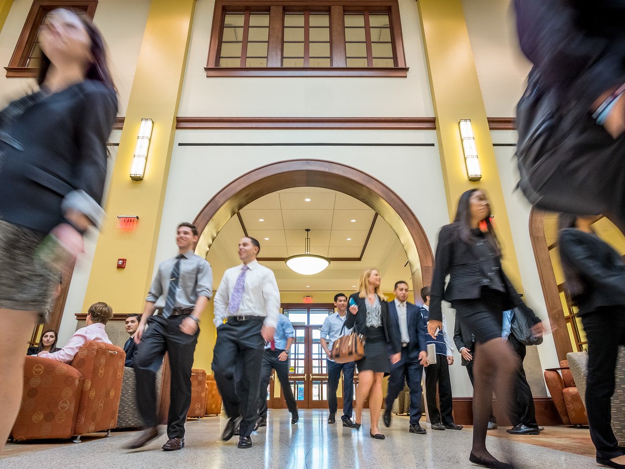 Students walking in School of Business building atrium