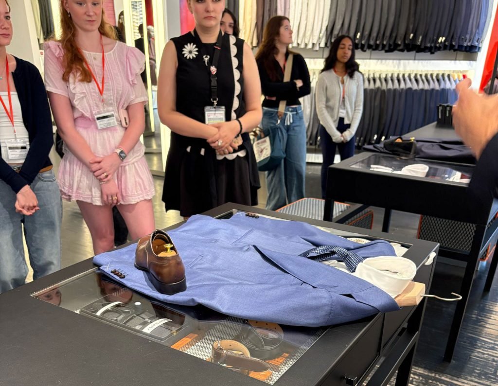 Students looking at a presentation during Fashion PreCollege 2025