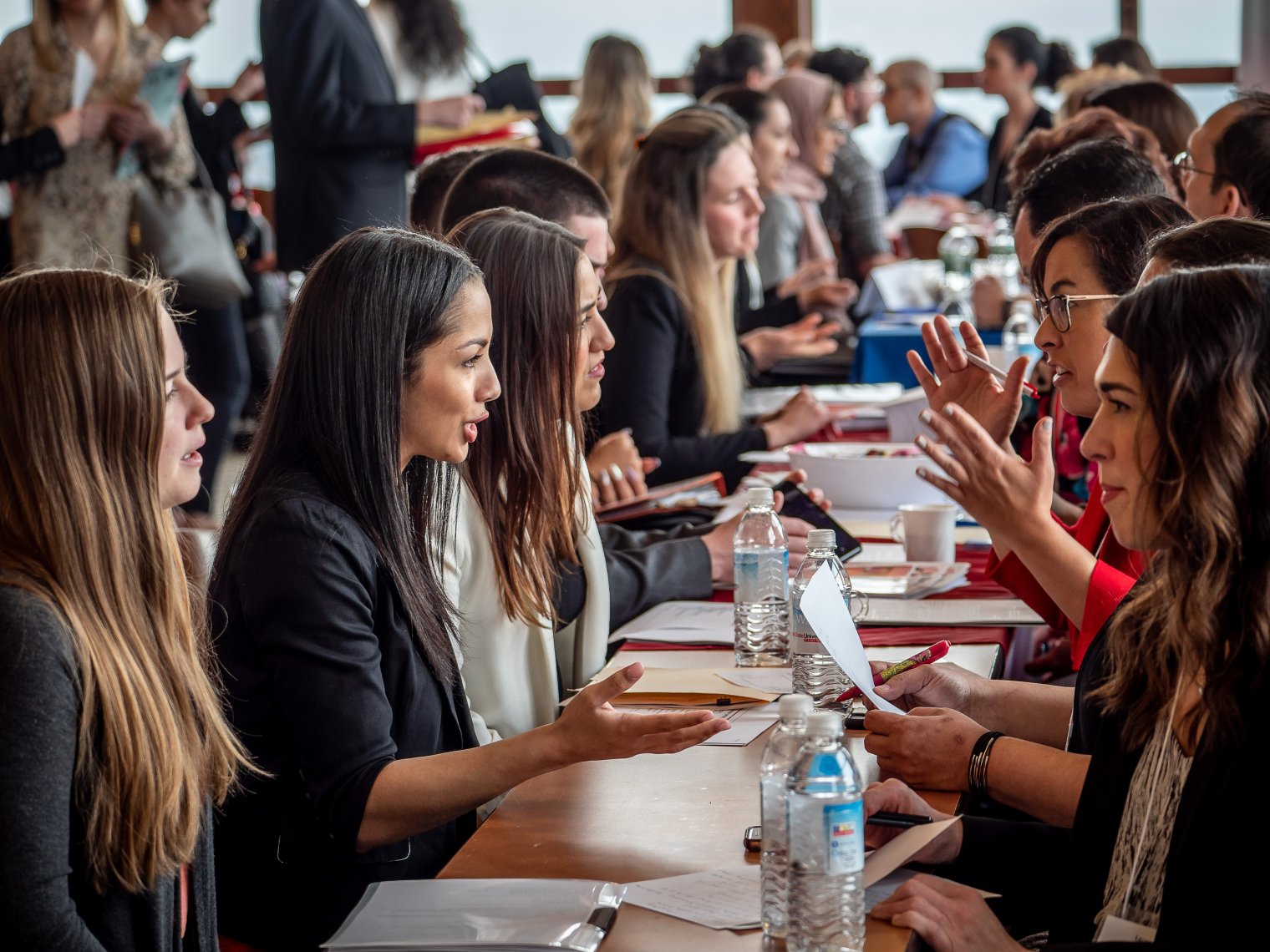 Professionals discussion across a long table