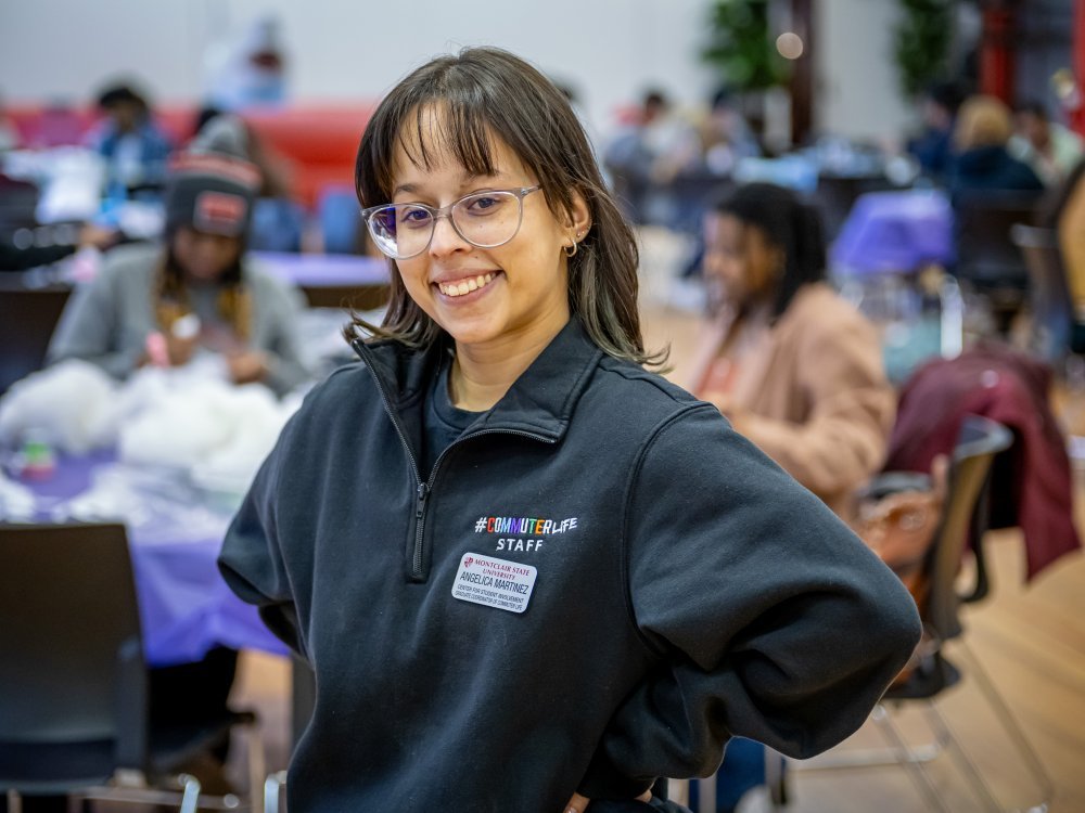 Student posing at campus event