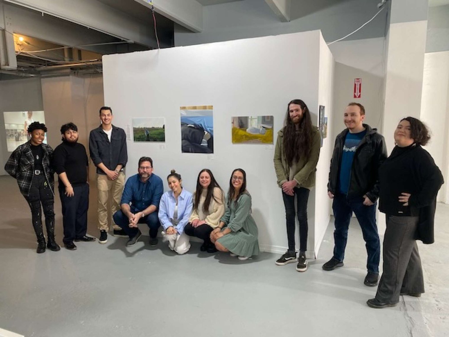 COIL Kaczmarek Spring 2023 Students in front of Art Wall