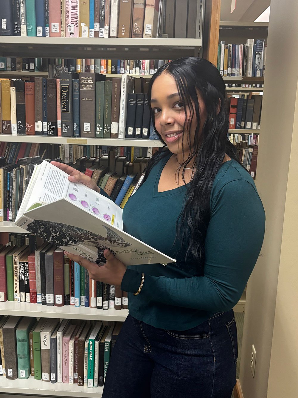 Juleini Nicole Garcia holding open book