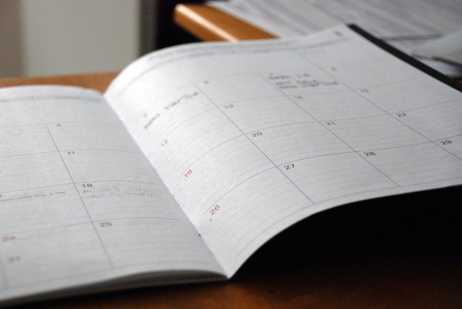 An open planning calendar with some notes