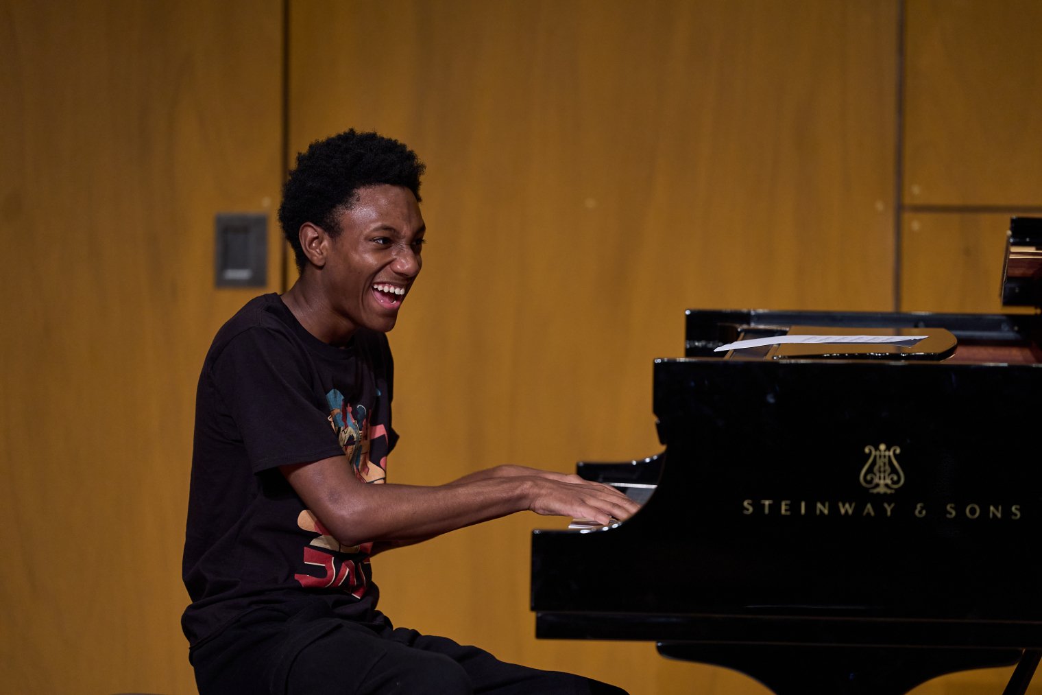 Pathways students having a blast playing piano on stage