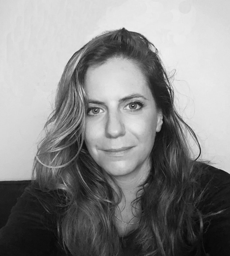 black and white image of woman posing for a headshot 