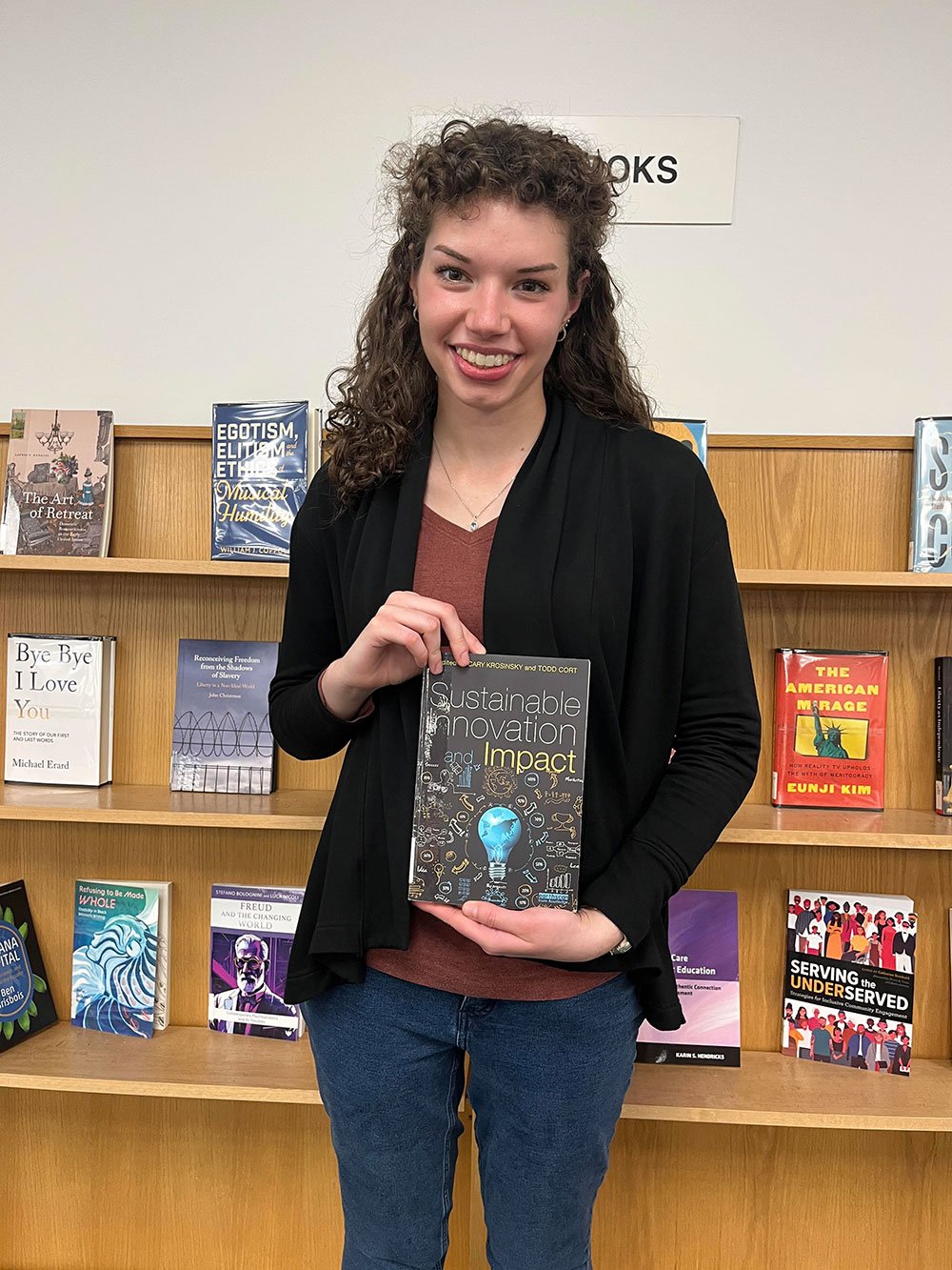 Emily Cepin holding book
