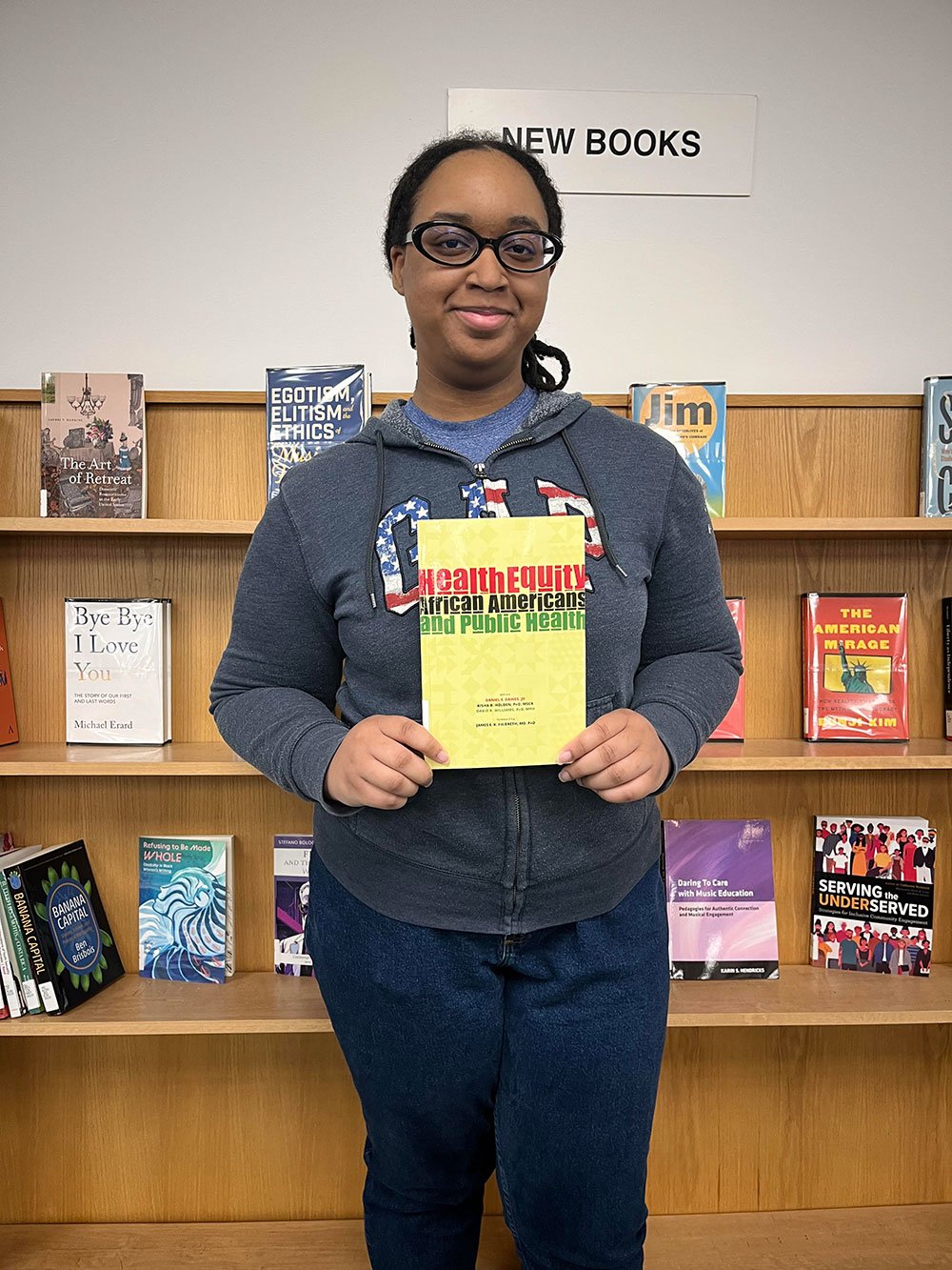 Morgan Winbush holding book