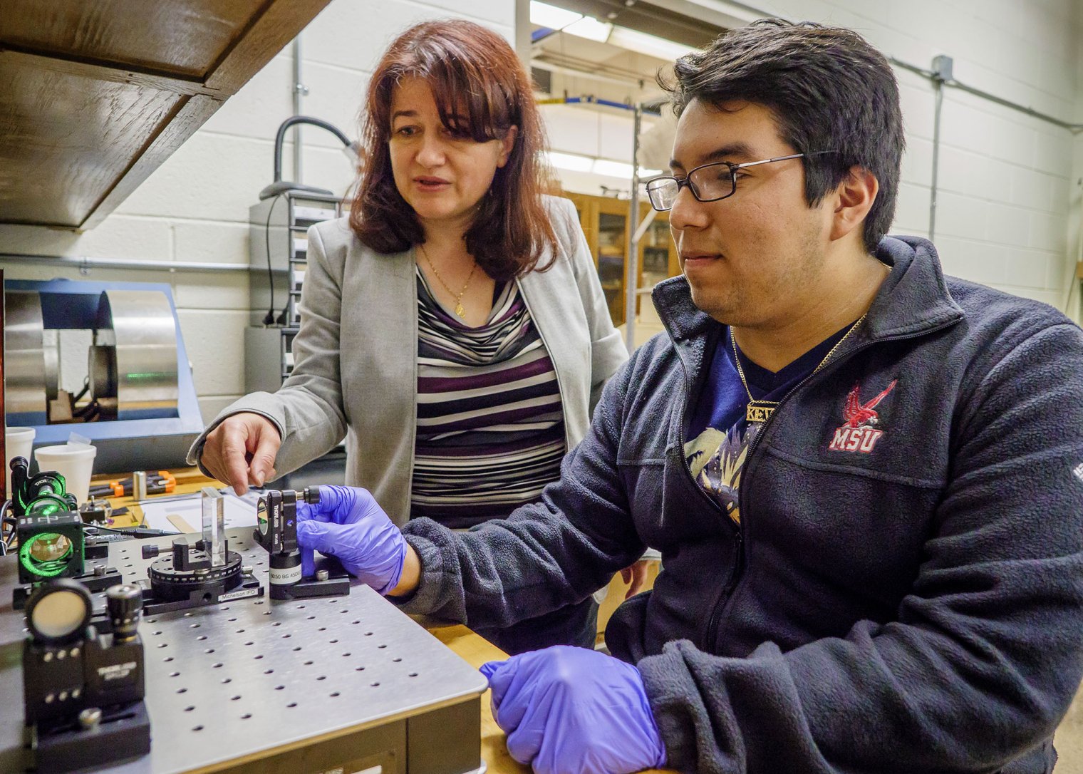 professor working with student on research