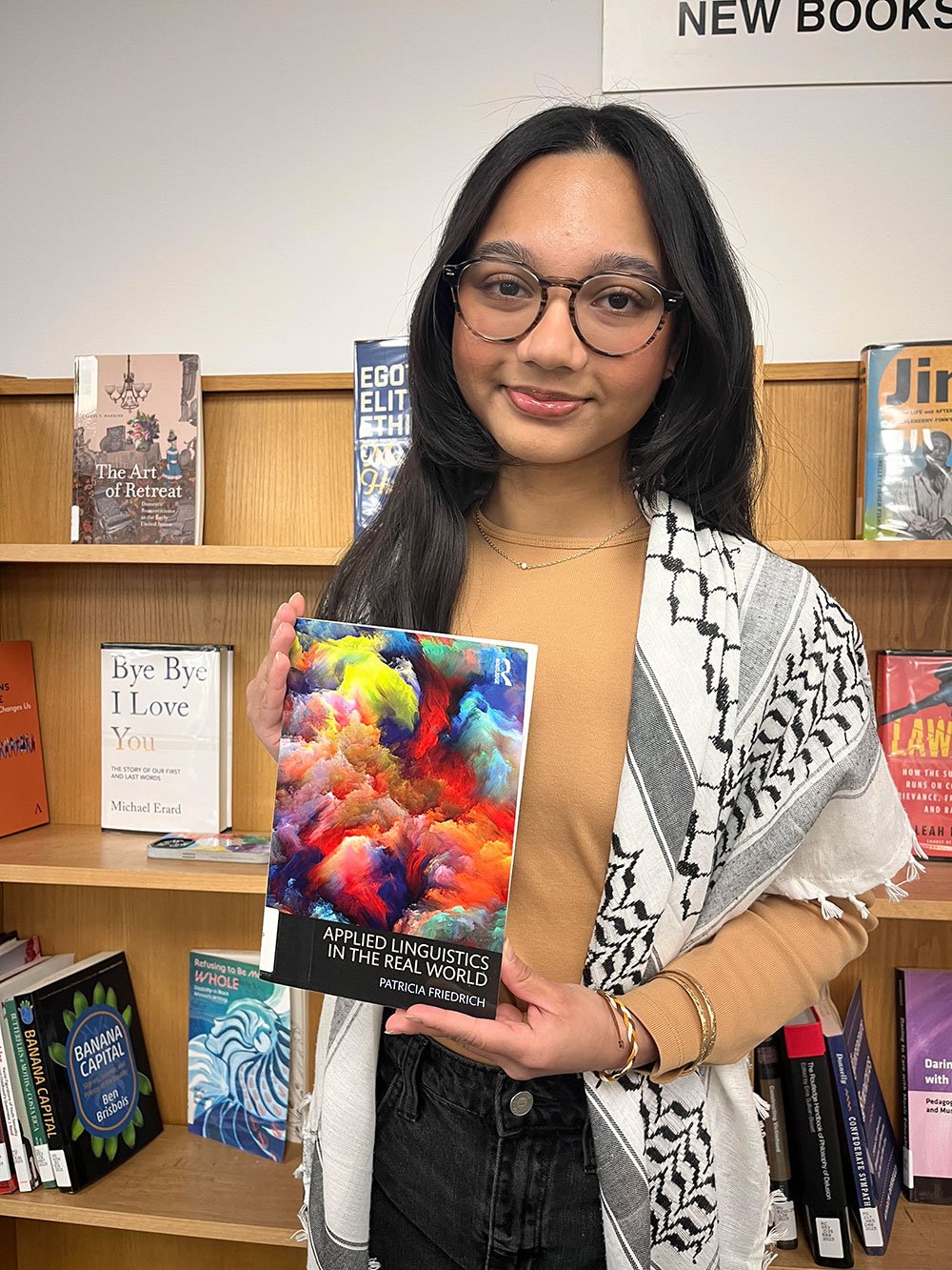 Shanaz Munna holding book