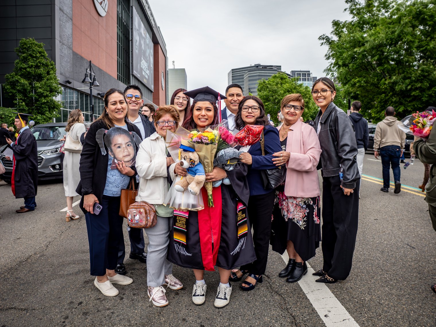 Graduate and loved ones outside Prudential Center