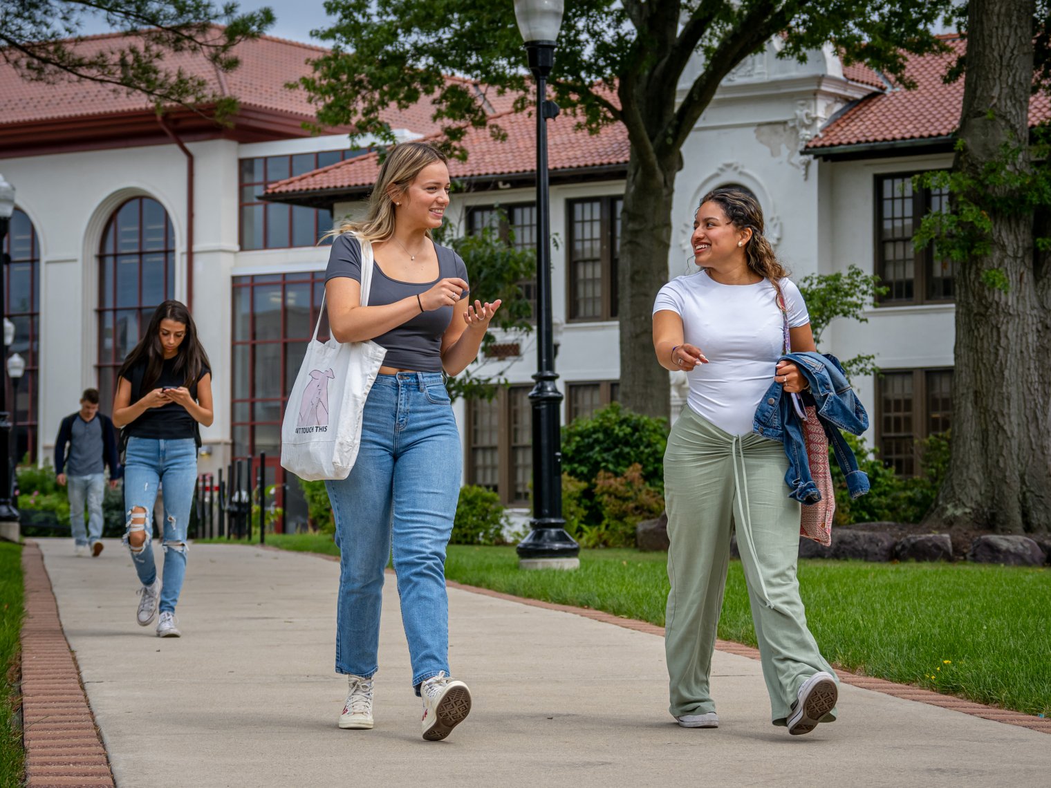 A picture of two students walking on campus