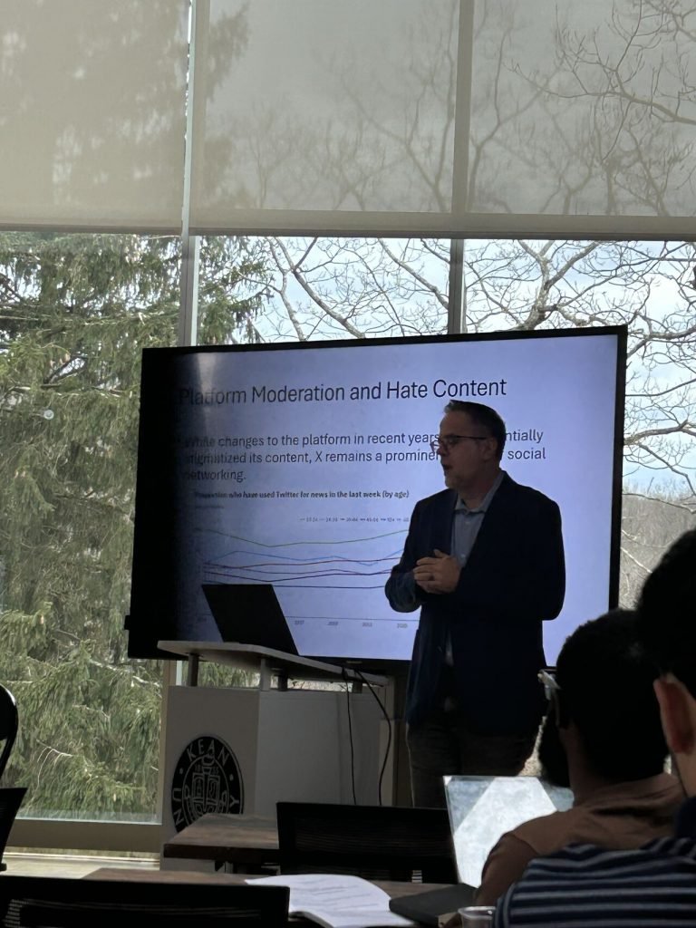 Professor Bond Benton presenting at conference.