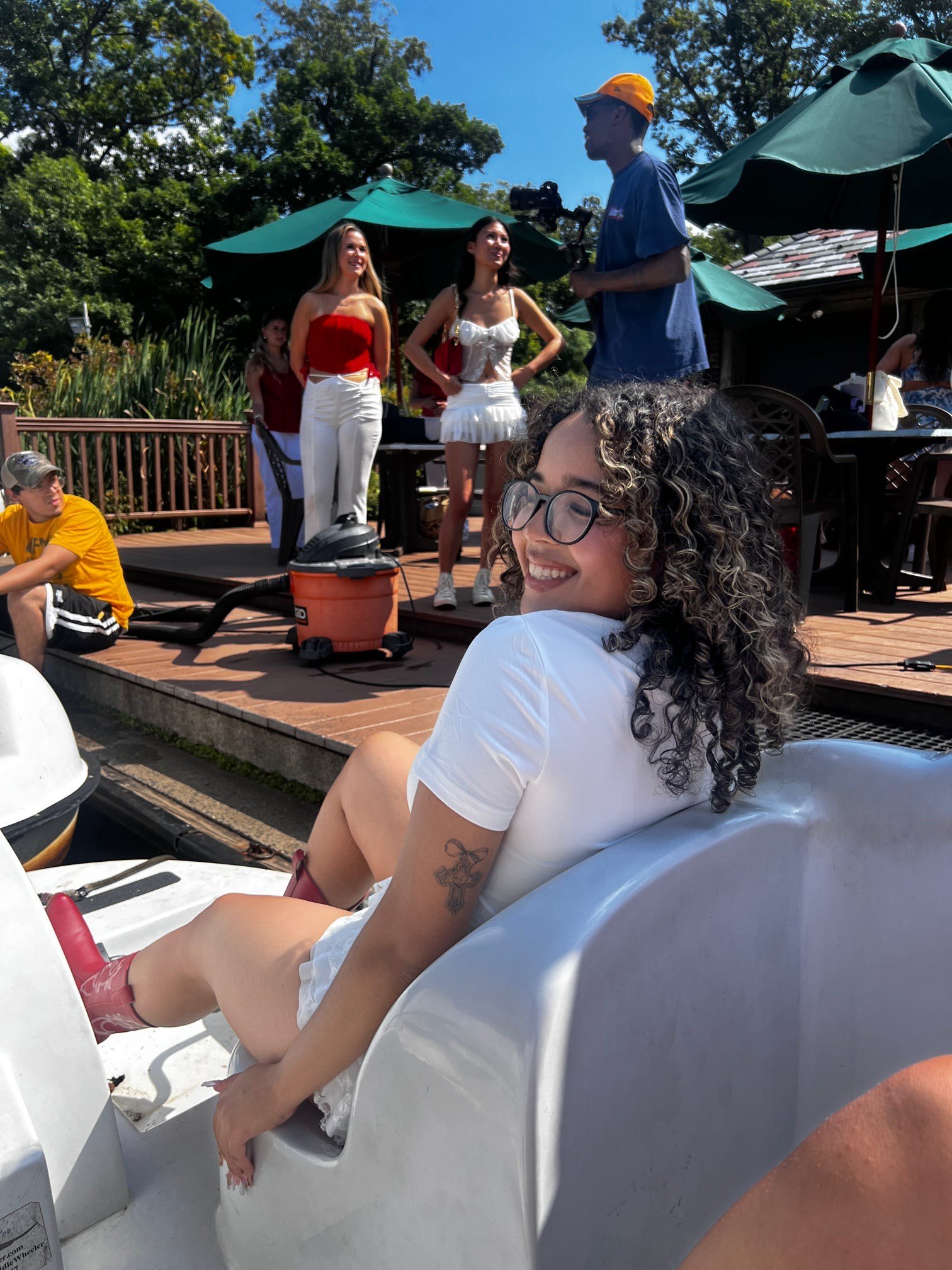 Tahina smiles in a paddle boat at an outing with friends.