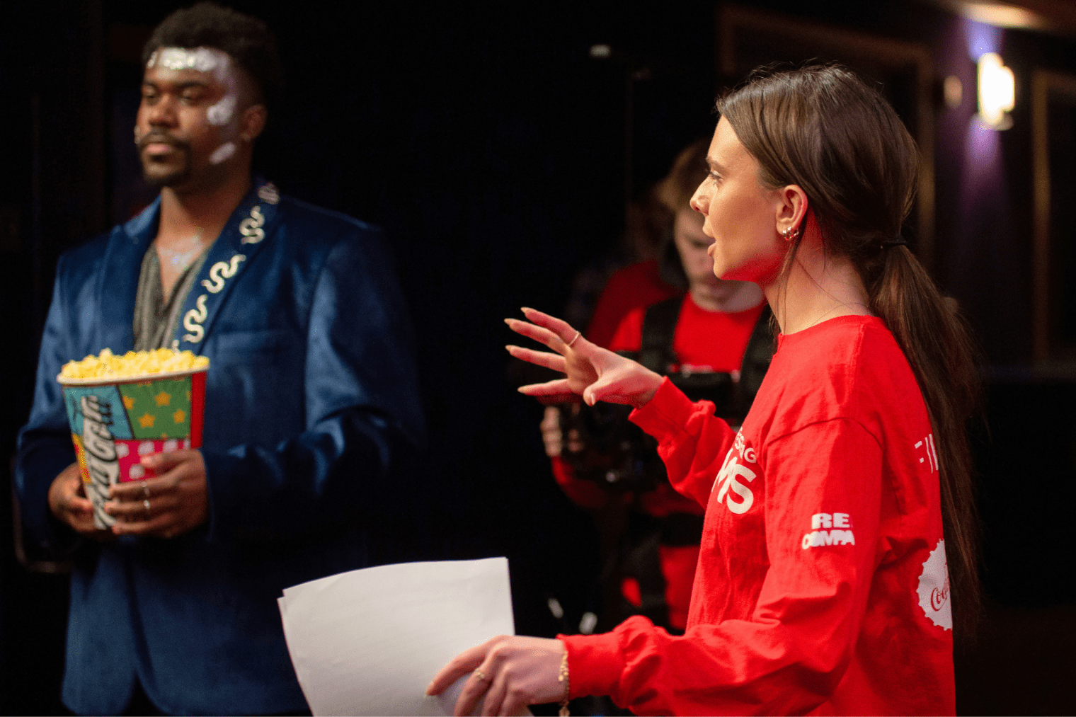 Student directing actors for a scene for a Coca Cola Refreshing film.