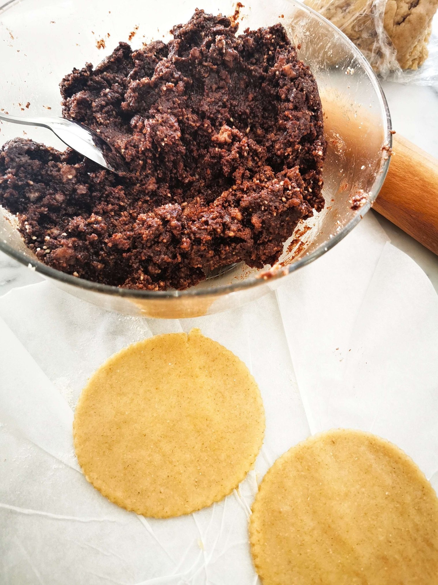 mpanatigghi filling in a bowl with pastry disks on the side