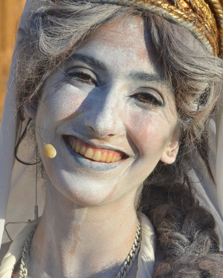 A headshot of a woman wearing an ancient Greek costume