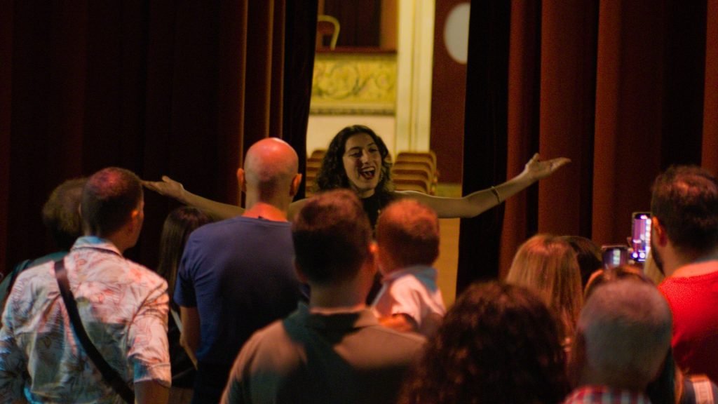 A woman addresses a crowd