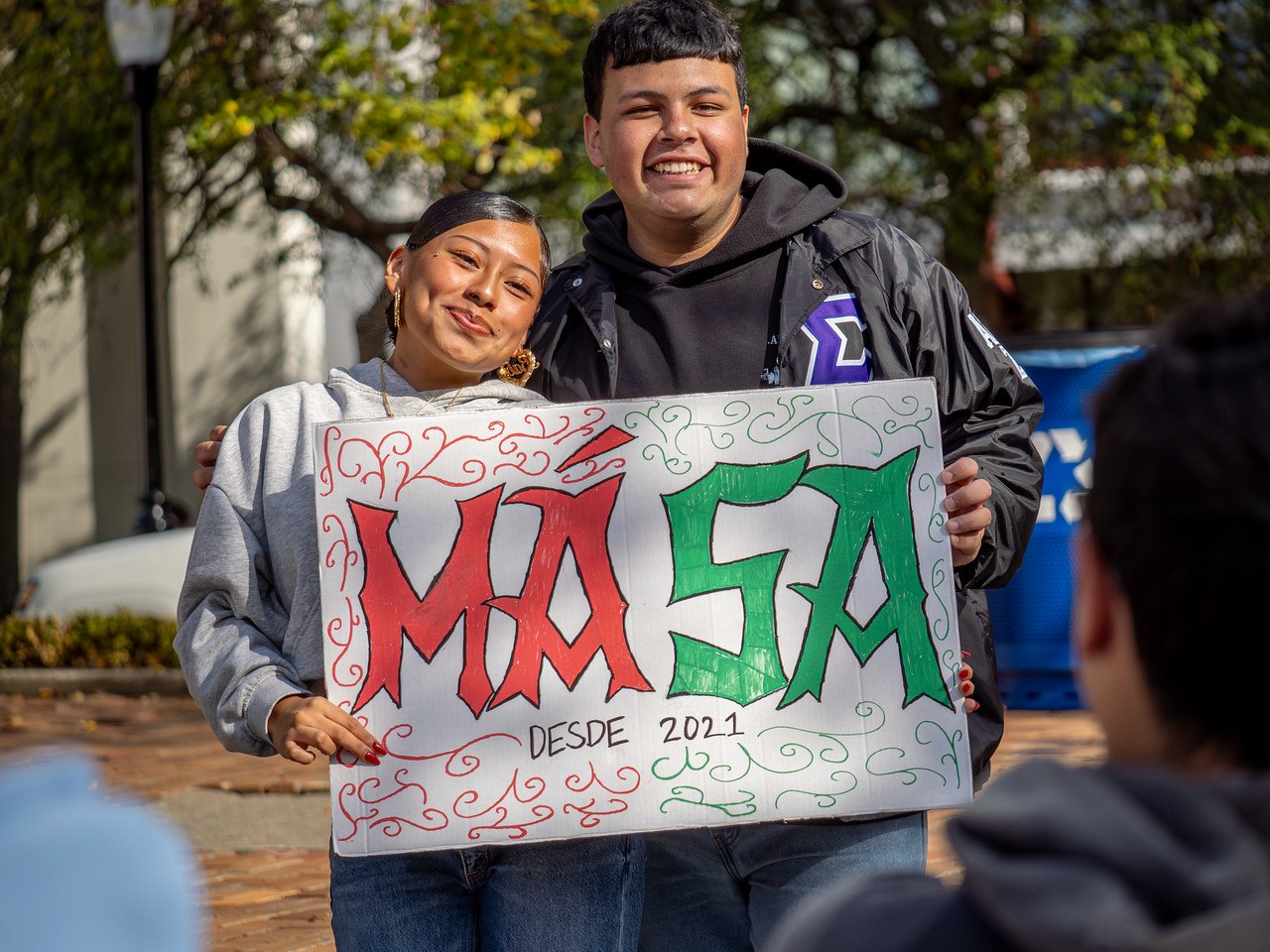 MASA Sign and Students at HHM Block Party