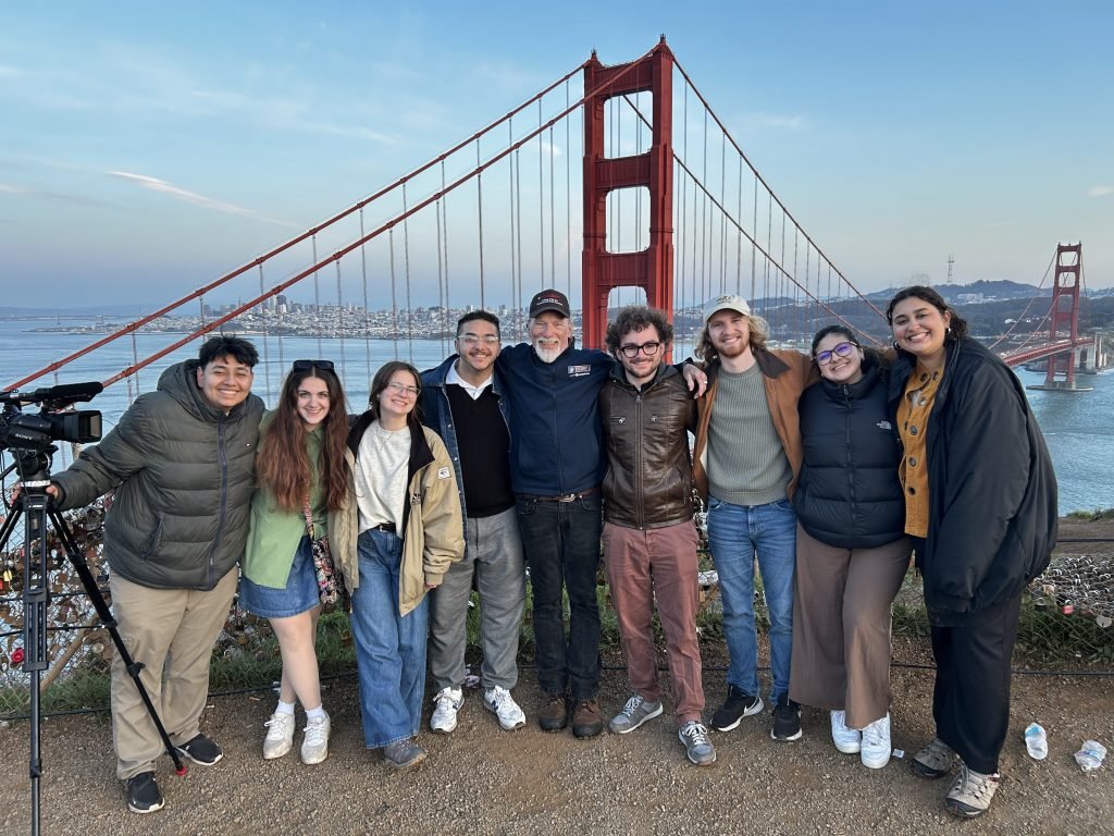 Group of students pose in front of Golden Gate bridge.