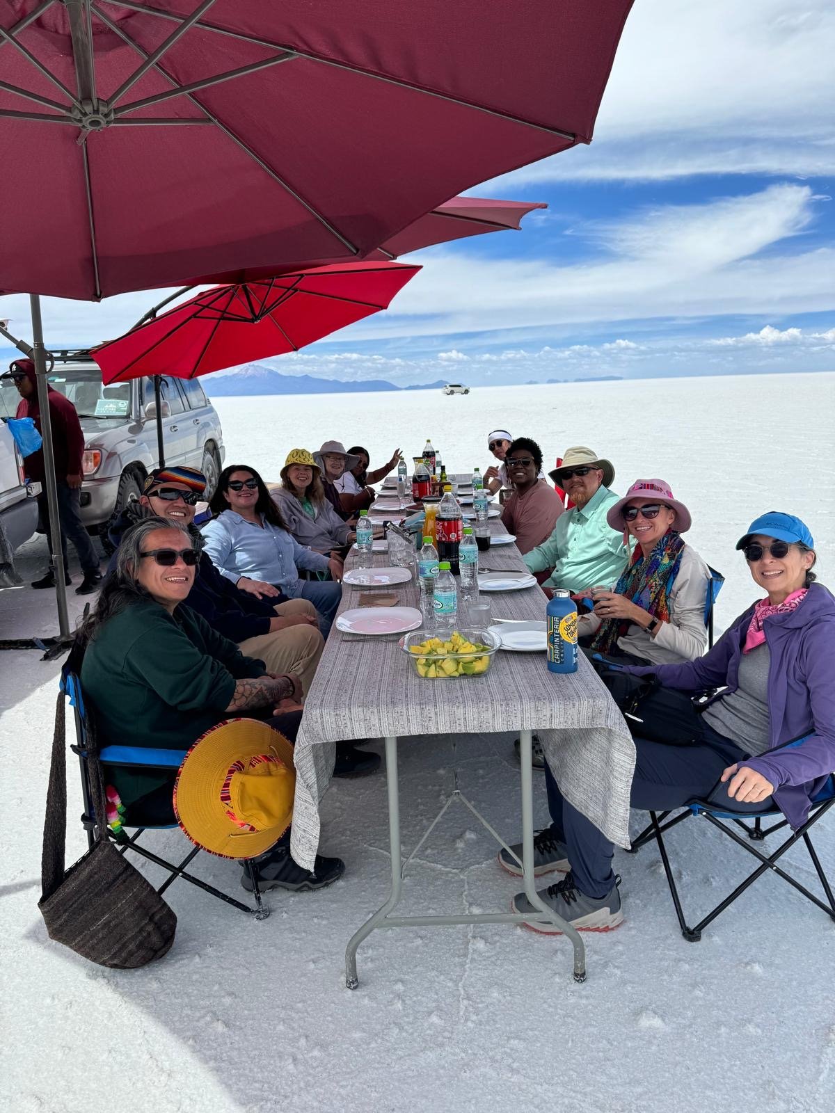 A group of college professors have lunch at a salt flat